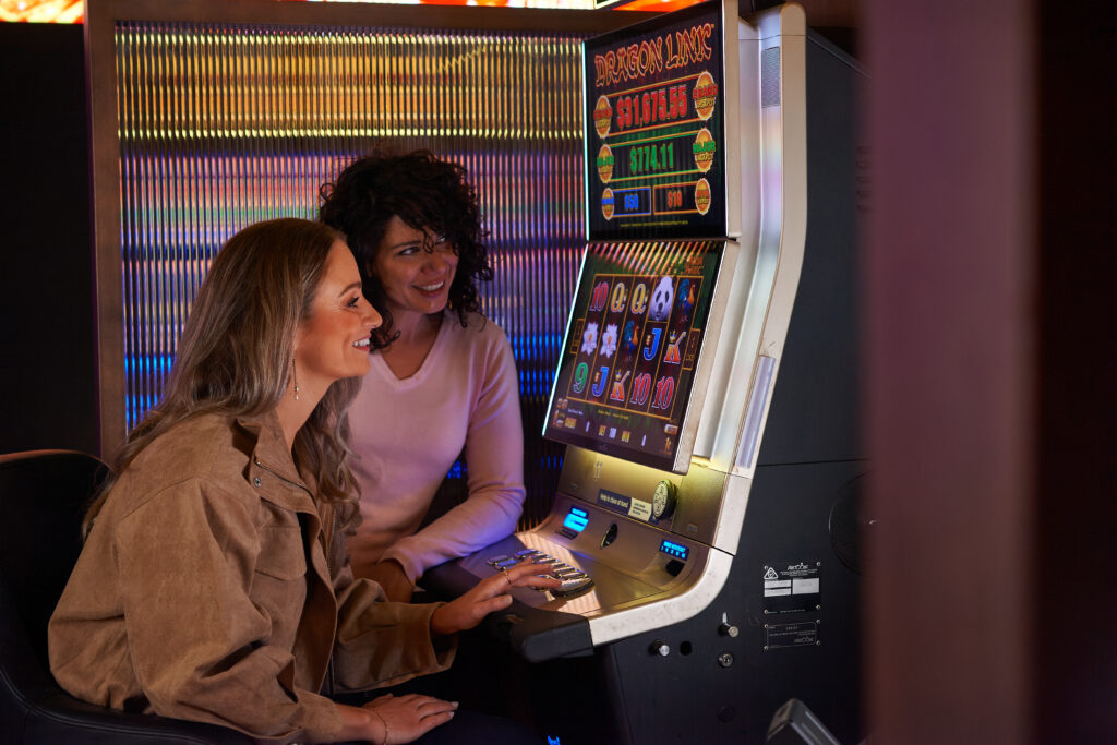 Patrons using an EGM in an Australian club.